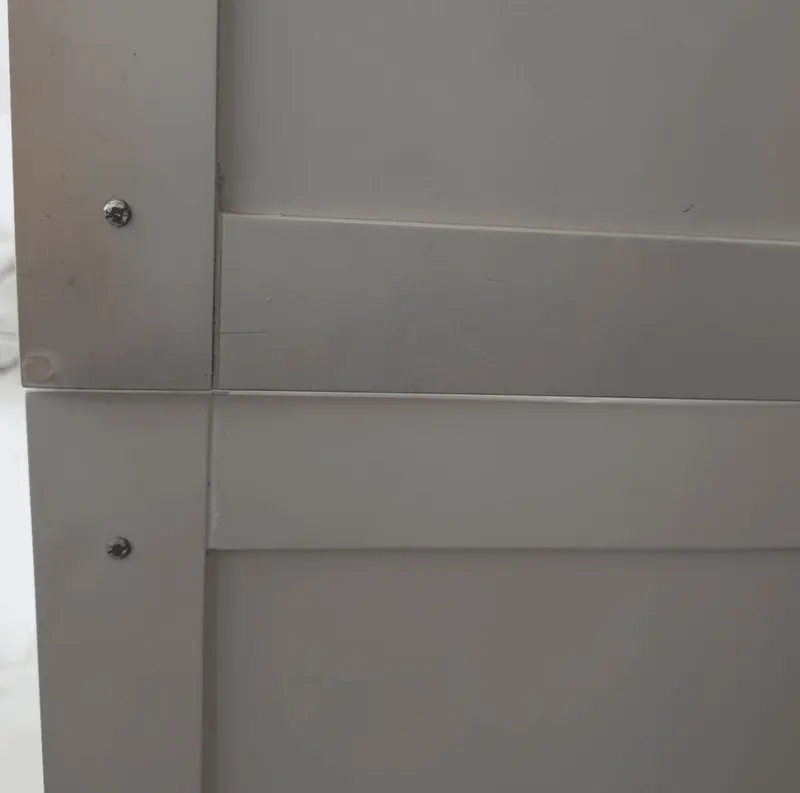 Close-up of the smooth, stain-free finish on refinished cabinet doors