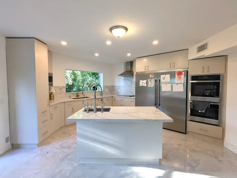 Fort Lauderdale kitchen after LUMA refinished every cabinet in Sherwin-Williams Accessible Beige