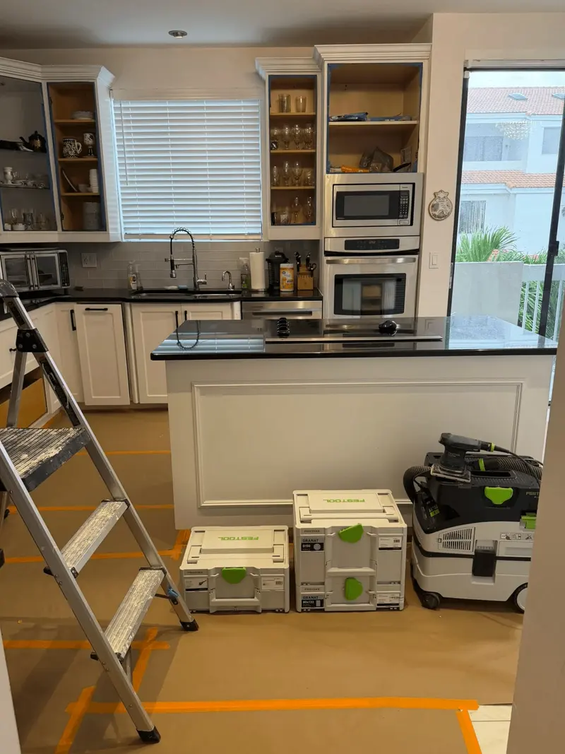 Hallandale Beach kitchen during prep, with ladder and dust-extraction equipment on site