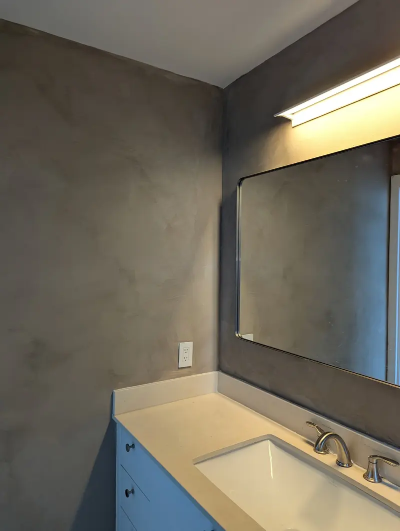 This bathroom was transformed from a basic space into a modern, sophisticated environment using limewash. Every step of the process was carefully completed, including a protective sealer for enhanced durability.